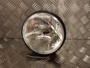7 inch Black Headlight from Triumph Custom Parts